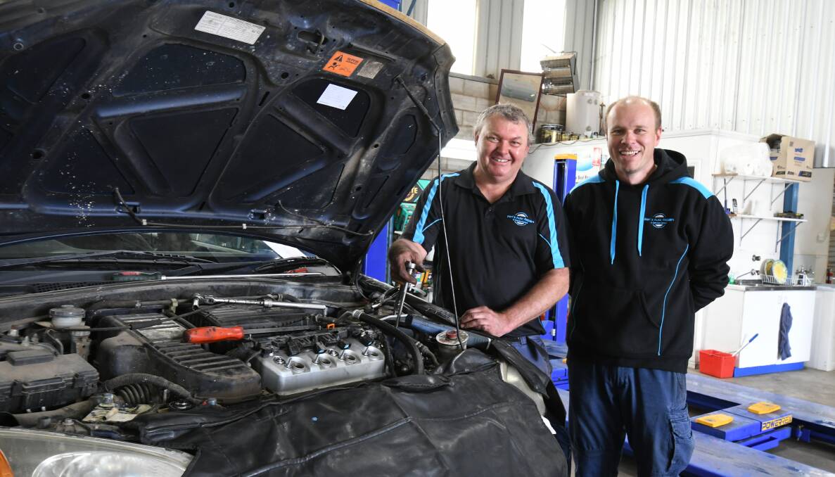 EXPANDED: Glen Magill and Ben Churchland at Ben's Auto Repairs and Service Centre in March Street. Photo: JUDE KEOGH 1010jkmechanic1