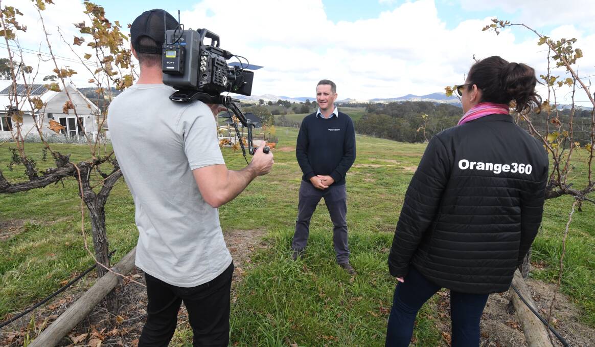 LIGHTS, CAMERAS, ACTION: Andrew Barnes, Tom Ward and Caddie Marshall film a video for the campaign to encourage tourists back to Orange. Photo: JUDE KEOGH