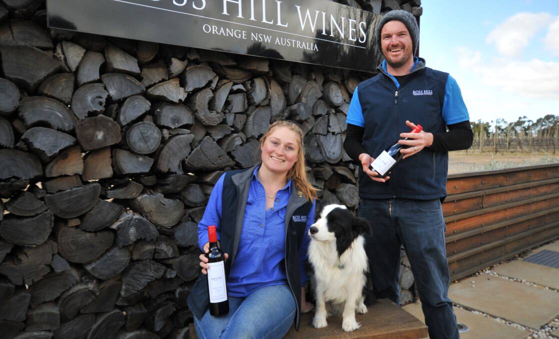 TOP EFFORT: Ross Hill Wines assistant winemaker Isabelle Locke, Holly and winemaker Luke Steele. Photo: JUDE KEOGH 