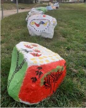 ROCKS: In Cootes Park Glenroi, a line of large rocks have been painted with Indigenous and other themes.