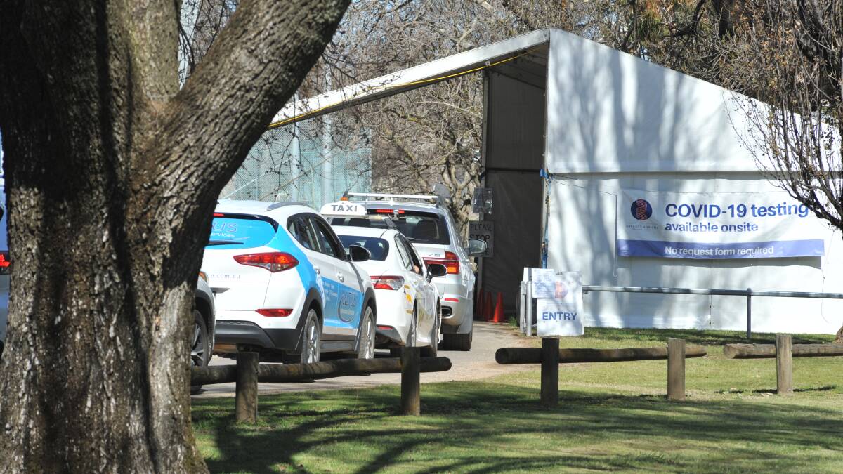 IN THE QUEUE: Cars in the line for people to get COVID tests at Wade Park on Sunday. Photo: CARLA FREEDMAN