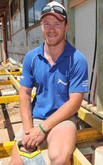BUILDING A CAREER: Oustanding fourth year apprentice Logan Brockmann on a construction site in Orange on Thursday. Photo: JUDE KEOGH