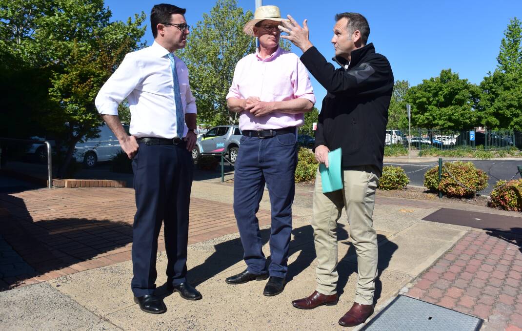 IT'S COMING: David Littleproud, Andrew Gee and Matt Ryan outside the future offices of the Regional Investment Corporation in Kite Street. Photo: DAVID FITZSIMONS 1031ric3