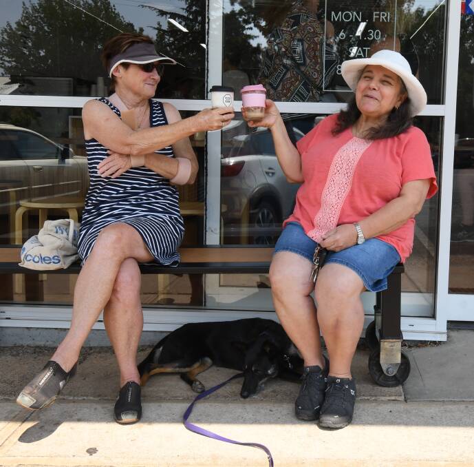 READY TO ROCK: Jill Trotter enjoys a coffee with her dog Bow and friend Anne Dib in Orange. Photo: CARLA FREEDMAN