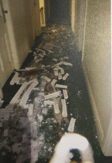 TRASHED: Asbestos and rubbish has contaminated the building as seen in this photo submitted in the DA.
