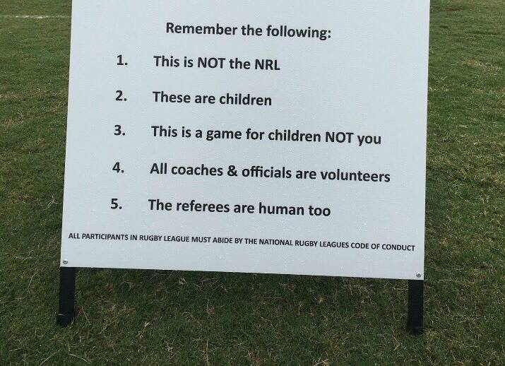 TAKE HEED: A warning sign for spectators at a junior rugby league ground makes the rules clear for all.