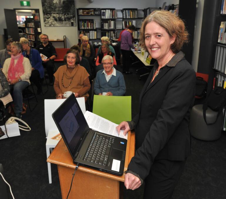 WARNING: Jill Marshall explains how to detect and avoid cyber scams to people at the Orange City Library on Monday. Photo: JUDE KEOGH 015jkcyber1