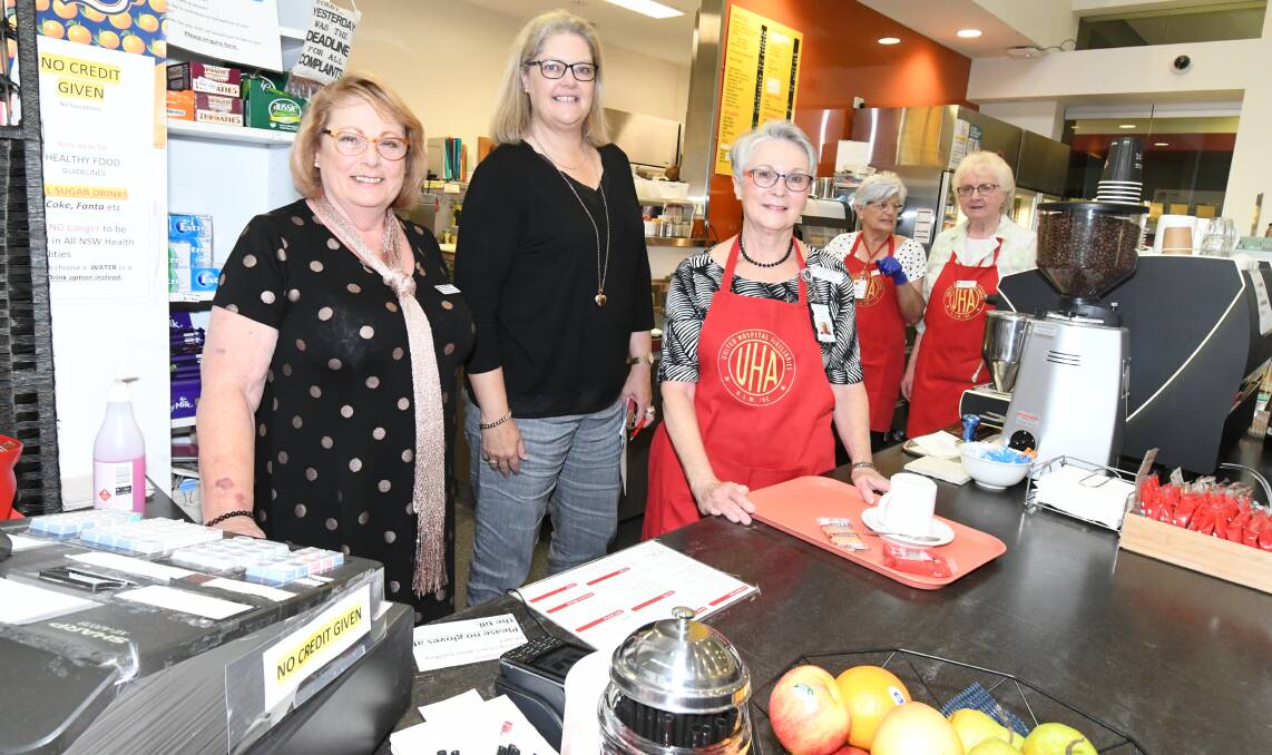 GREAT WORK: Tracey Wilkinson, Catherine Nowlan, Christine Hannus,
Kay Kennedy and Judy Curtin at the Orange hospital auxiliary canteen. 
Photo: JUDE KEOGH 1105auxiliary1