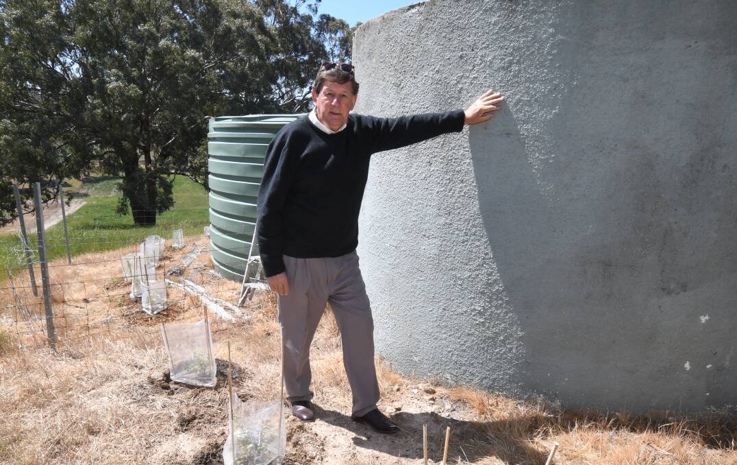 VITAL STORAGE: Reg Kidd says rainwater tanks are a valuable asset to save water to use on your garden. Photo: JUDE KEOGH