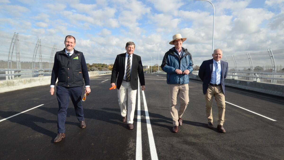 FIRST TRIP: Sam Farraway MLC, mayor Reg Kidd, Member for Calare Andrew Gee and Cr Jeff Whitton on the new bridge. Photo: JUDE KEOGH