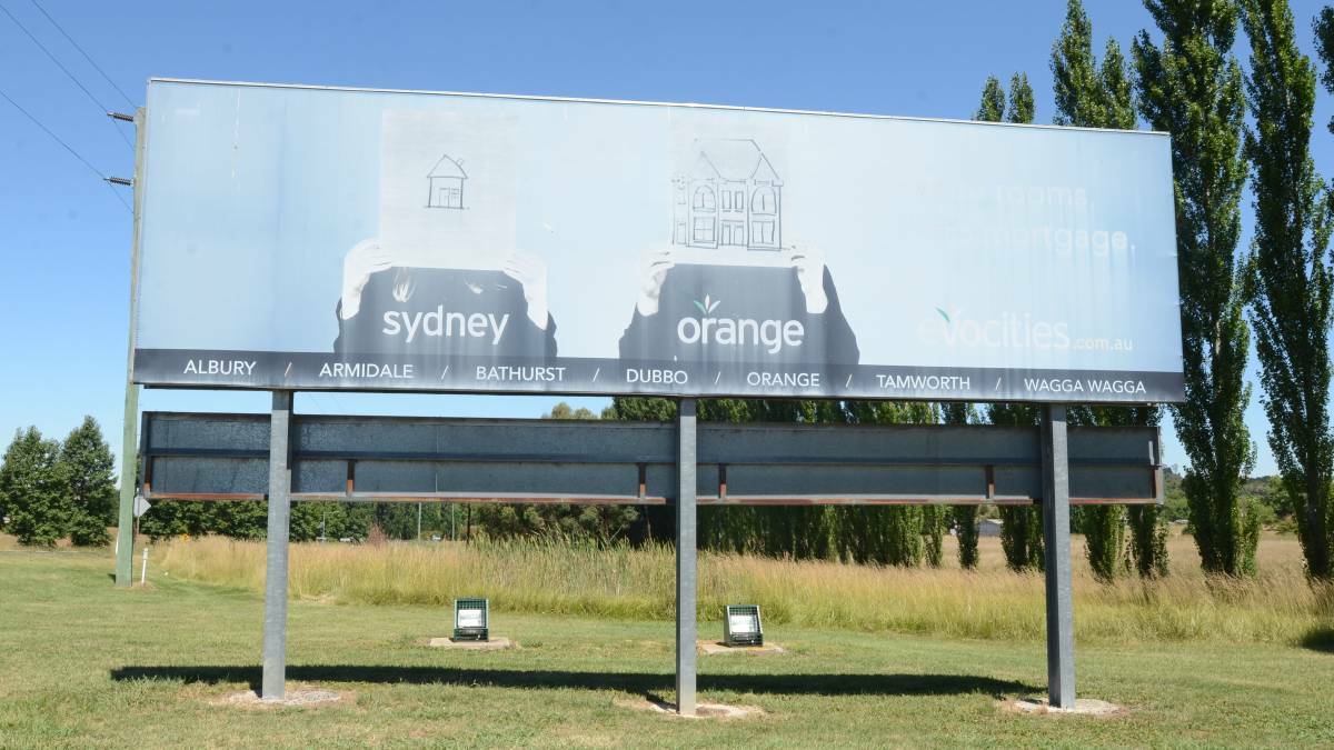 FADING: An Evocities billboard in Orange.