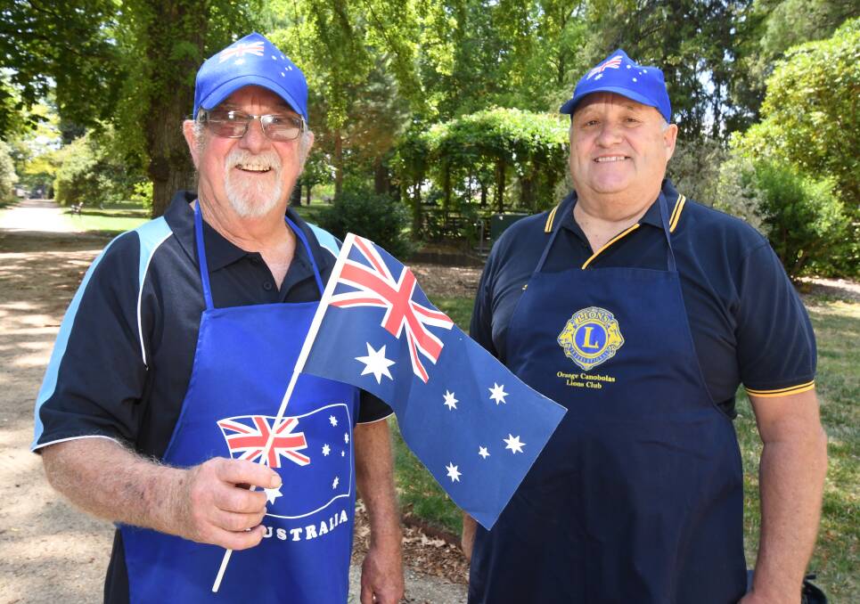 COOKING FOR AUSTRALIA DAY: Peter Chilcott and Steve Brakenridge from the Canobolas Lions Club. Photo: JUDE KEOGH