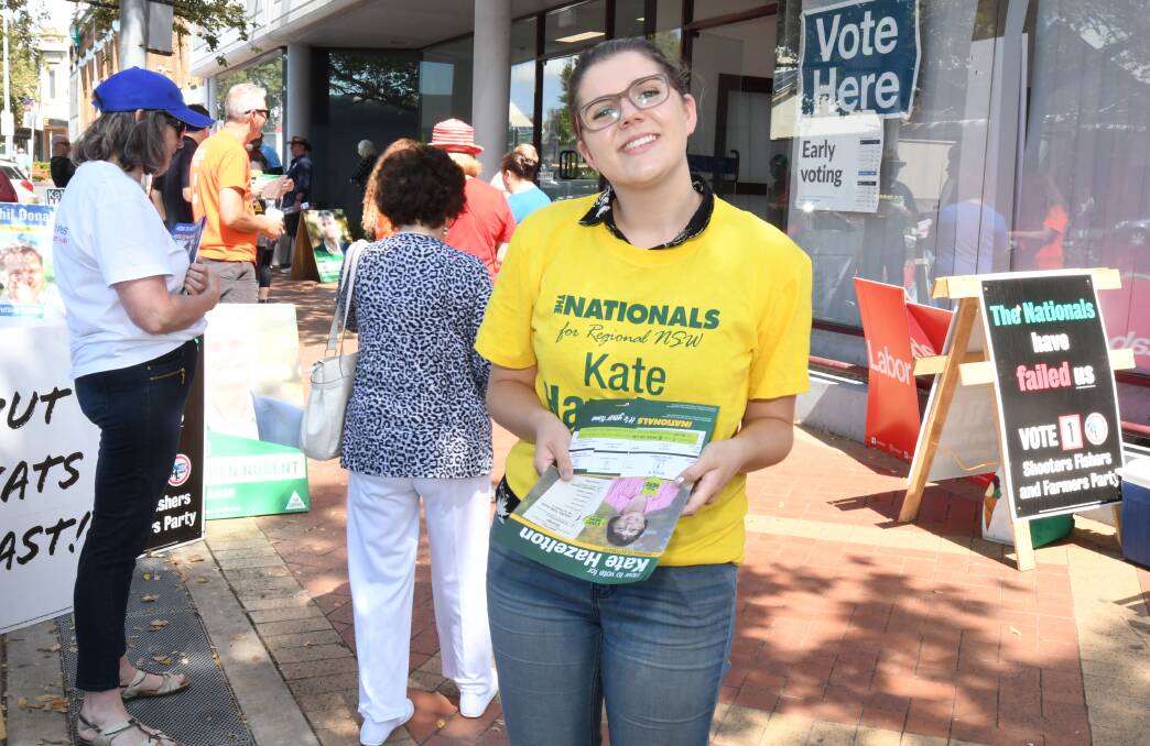 ELECTION WORK: Annie Hazelton hands out how-to-vote cards at the voting centre in Peisley Street. Photo: JUDE KEOGH