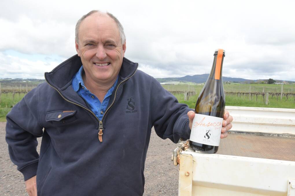 ORANGE TO SWEDEN: See Saw Wines owner Justin Jarrett with a bottle of Ausecco sparkling wine. Photo: JUDE KEOGH