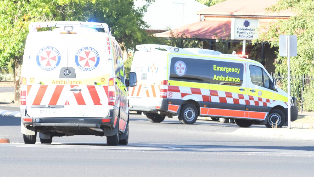 AT THE SCENE: Two ambulances leave the accident site at Five Ways. Photo: JUDE KEOGH