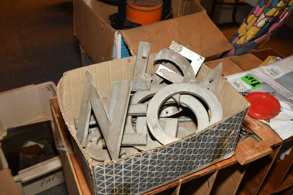 WHERE ARE THEY NOW: After being removed from the front wall the missing letters were put in a box awaiting sale at the church back in 2019. Photo: CARLA FREEDMAN