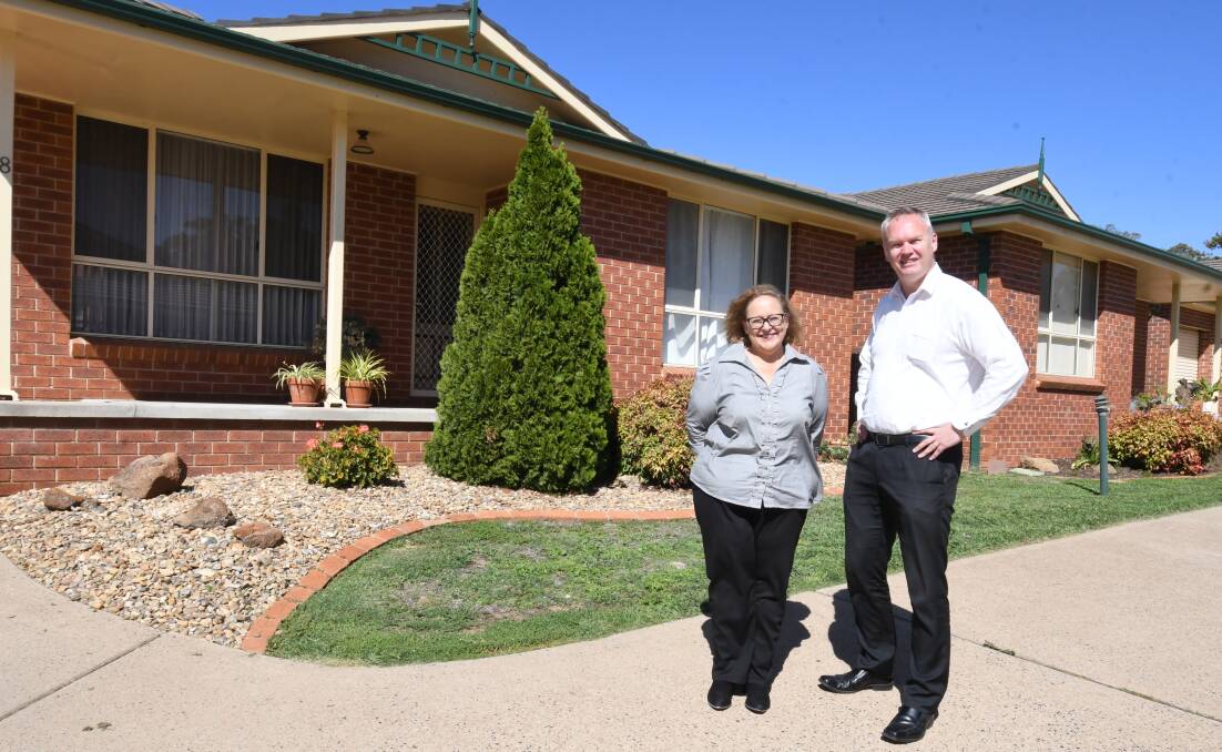 WHAT'S AVAILABLE: Century 21's Amanda Shirvington and Andrew Vogler at a two-bedroom unit in Peisley Street for rent at $280 a week. Photo: JUDE KEOGH