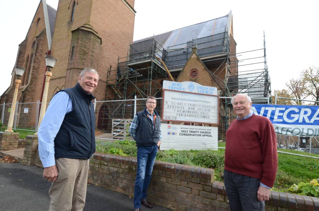 UNDERWAY: Garry West, Rod Wykes, Ernest Shave from the Holy Trinity Foundation in front of the roof repair work at the church. Photo: JUDE KEOGH