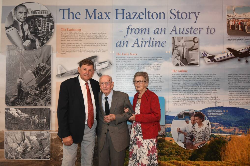 HISTORY ON THE WALL: Cr Reg Kidd with Max and Laurel Hazelton. Photo: CARLA FREEDMAN