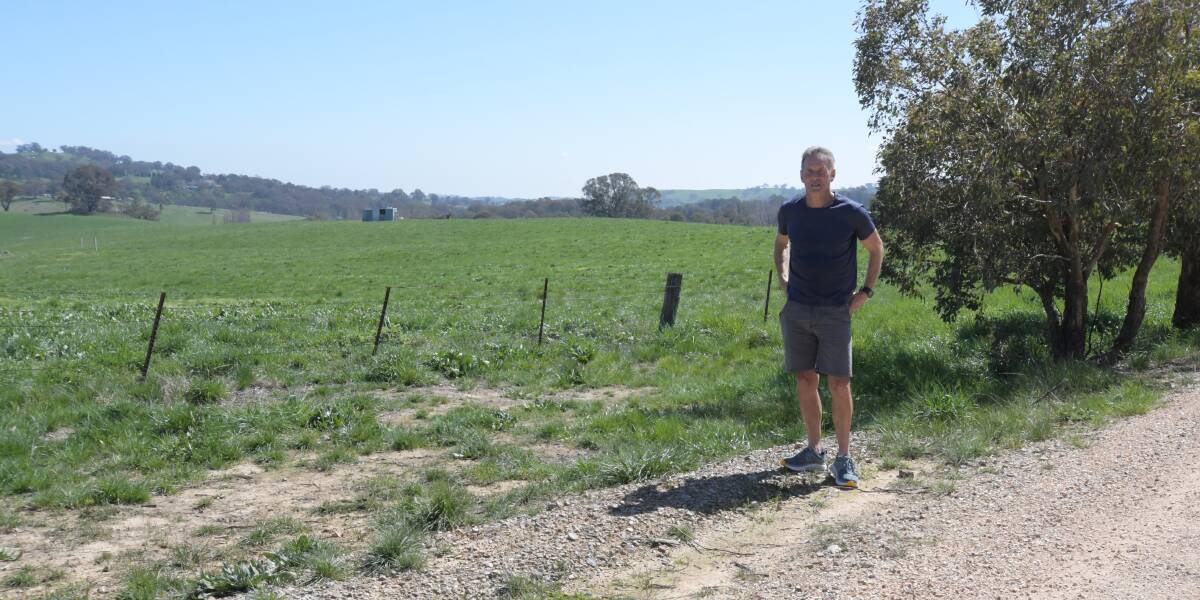 OPPOSED: Farmer Rob Green on his property, which is next to and overlooks, the proposed solar farm development site. Photo: JUDE KEOGH