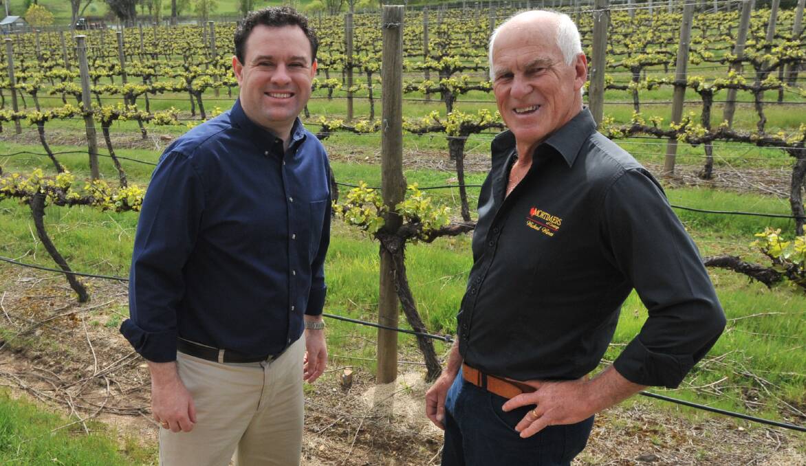 TOP DROPS: Trade minister Stuart Ayres and Mortimers Wines owner Peter Mortimer discuss the export wine deals boosting revenue for Orange wineries. Photo: JUDE KEOGH
