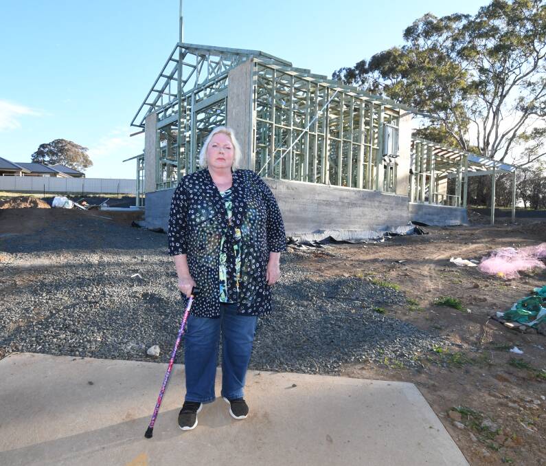 SPIRITS LIFTED: Fiona Bond at her house construction site. Photo: CARLA FREEDMAN