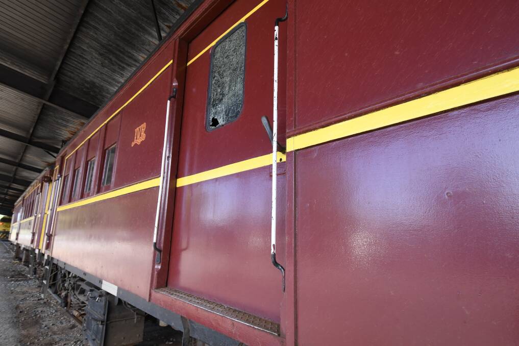 SMASHED: The damaged side window on the historic rail motor in Orange. Photo: CARLA FREEDMAN
