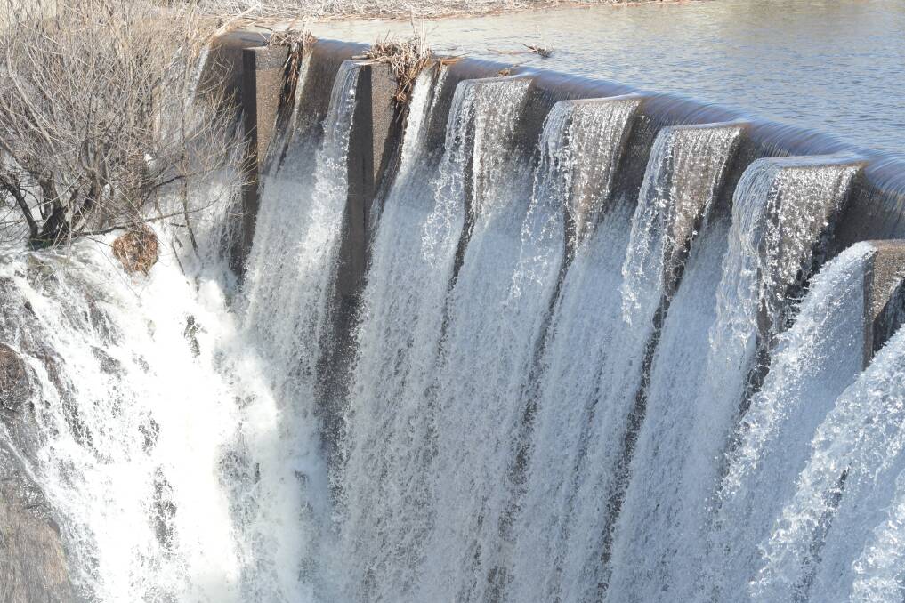 OVER THE TOP: Water gushes over the spillway at Spring Creek Dam on Monday. It is full after major winter rain this month. Photos: CARLA FREEDMAN