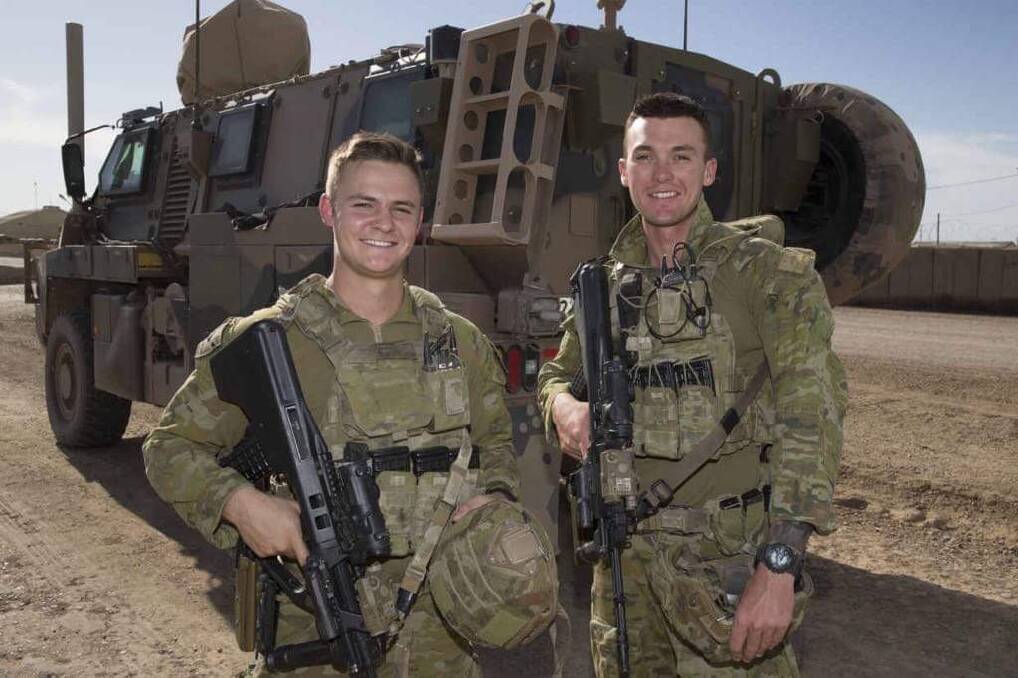 SOLDIERS: Cousins and privates Joshua McDonald and Malcolm Davis have served together for the Australian Army in Iraq as members of the 5th Battalion. Photo: Supplied