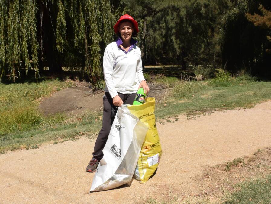 TWO BAGS FULL: Fiona Hawke found plenty of rubbish at Moulder Park. Photo: DAVID FITZSIMONS