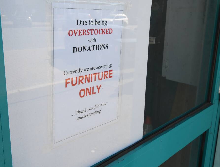 SIGN OF THE TIMES: A notice on the doors of the Salvation Army shop. Photo: JUDE KEOGH 0723jksalvos3