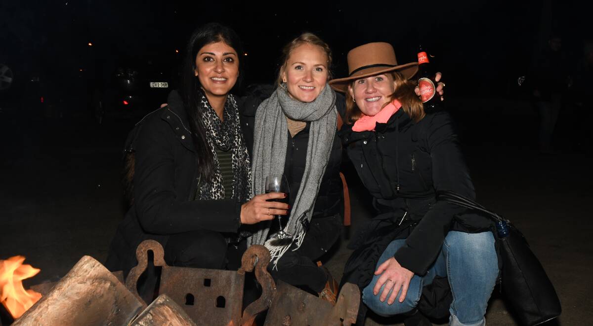 WINTER WARMER: Joey Soin, Lucy Ryan and Bex Meek enjoy their night out at The Agrestic Grocer as part of the Winter Fire Festival. Photo: CARLA FREEDMAN 0804cfagrestic1
