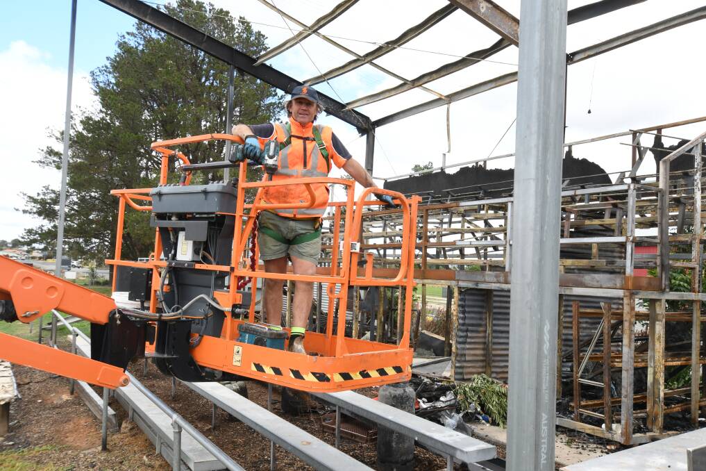 IN PROGRESS: Fletcher Niven dismantles the Pride Park grandstand he built several years ago after it was badly damaged by fire in December. Photo: JUDE KEOGH 