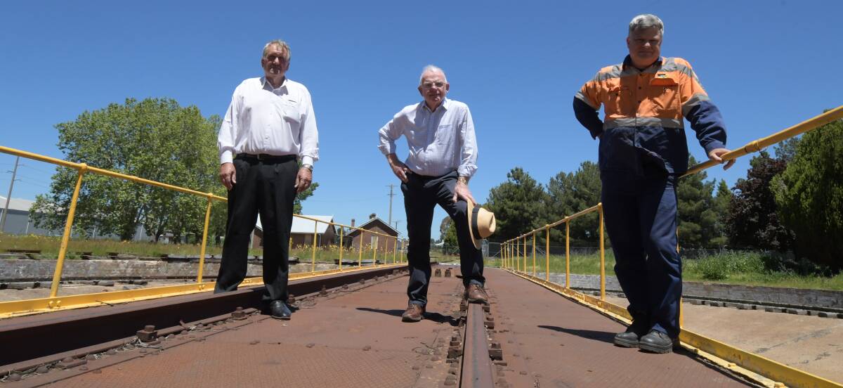ON THE MOVE: Wade Mahlo, David Hill and John Healey on the turntable at East Fork after meeting on Tuesday to discuss the Lachlan Valley Railway's plans. Photo: CARLA FREEDMAN