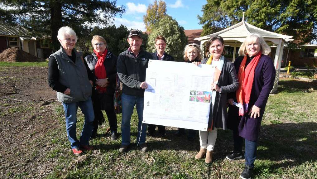 COMMUNITY PLAN: Gail Pringle, Tracey Wilkinson, Terry Hinchcliff, Helen Mobbs, Janice Harris, Sarah Hoskin and Jenny Hazelton on the site of where the palliative care garden would go if Uniting Parkwood is approved as a permanent facility. Photo: JUDE KEOGH