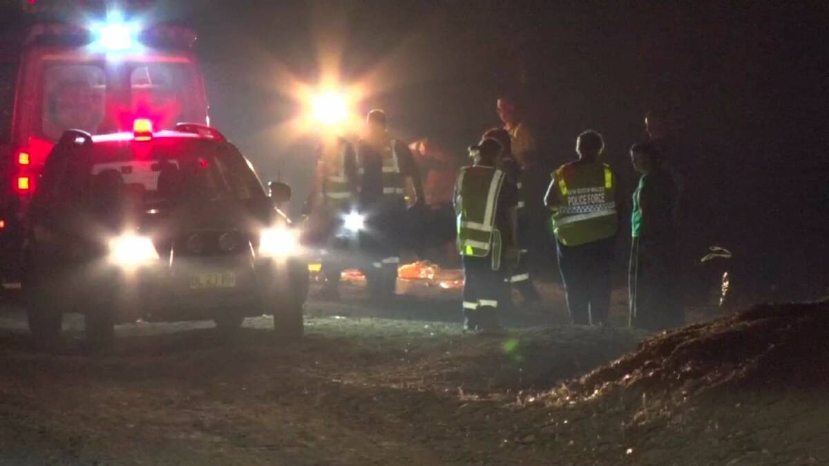 CRASH SCENE: Police, paramedics and rescue crews at the scene of the crash at Gumble, west of Molong, on Friday night: Photo: Supplied, TROY PEARSON/TNV