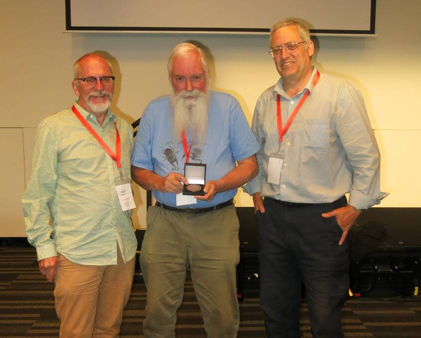 PROUD MOMENT: Murray Fletcher with the incoming AES president Dr David Merrit and the outgoing president Professor Phil Weinstein. Photo: Supplied, Vicki Glover