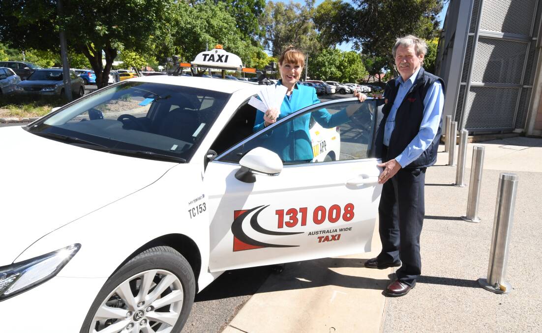 TAKE A TIP: Road Safety Officer for Orange and Cabonne councils Andrea Hamilton-Vaughan with cab driver Rod Moscrop. Photo: JUDE KEOGH