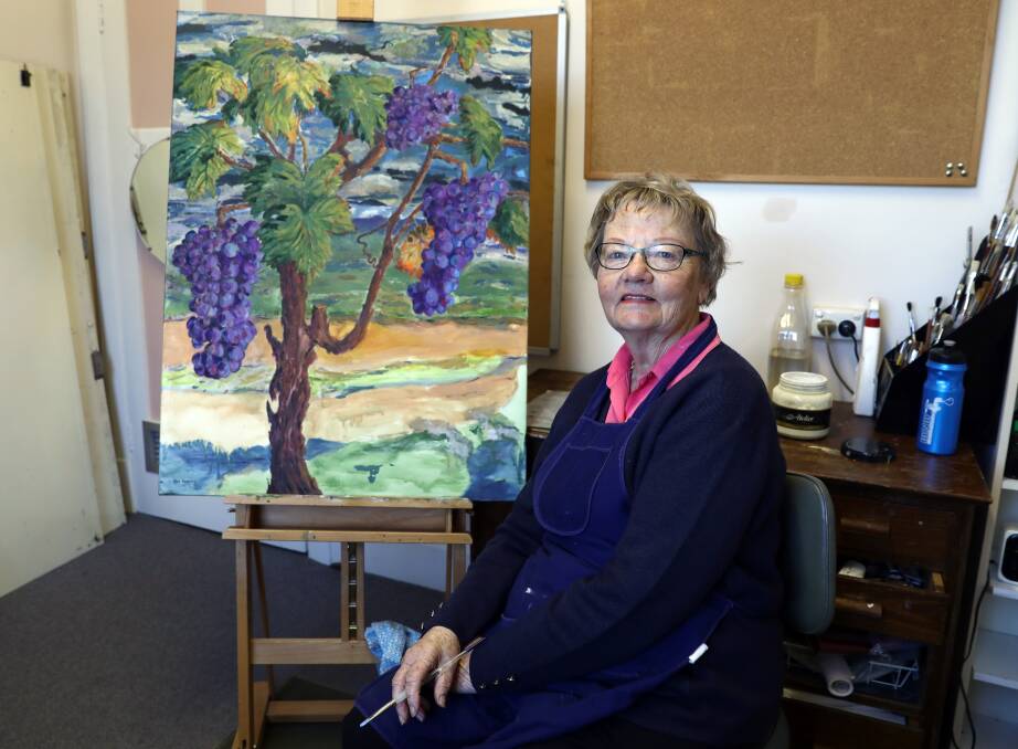 CREATIVE: Artist Beverley Duncan works on her painting to be shown as part of the Orange Wine Festival Exhibition. Photo: ANDREW MURRAY1006amart16761