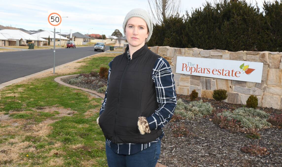 IT'S NOT SAFE: Melanie McDonell at the corner of the Escort Way and Poplars Drive where she is calling for footpaths to be installed in the area. Photo: JUDE KEOGH