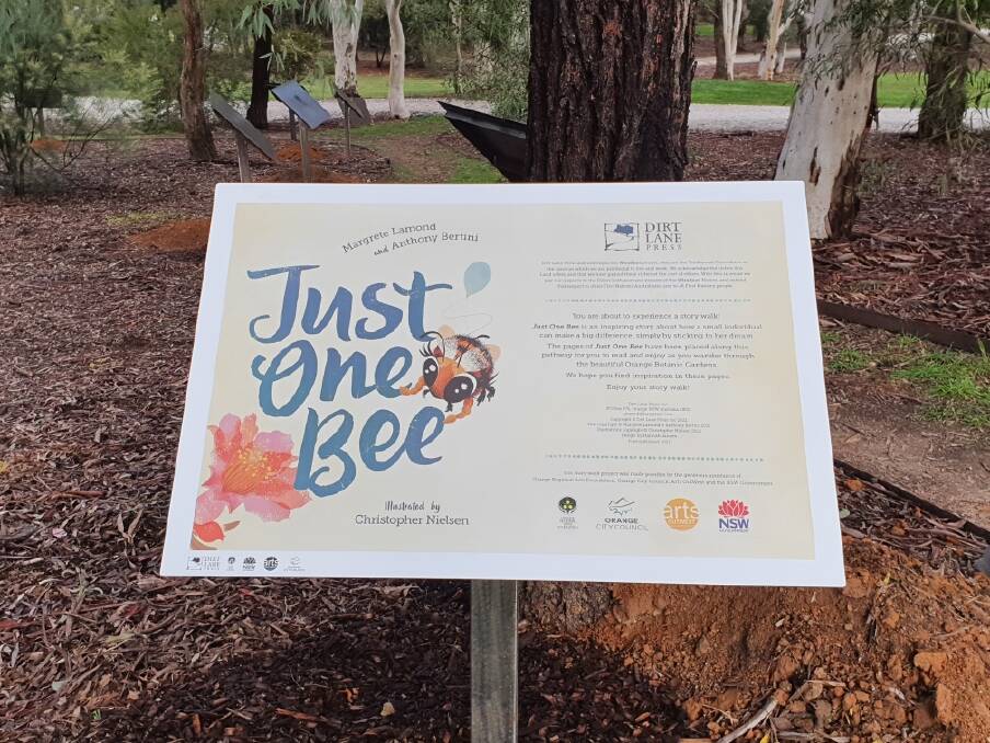 TAKE A WALK: Story boards enable people to read the book while strolling through the Botanic Gardens.