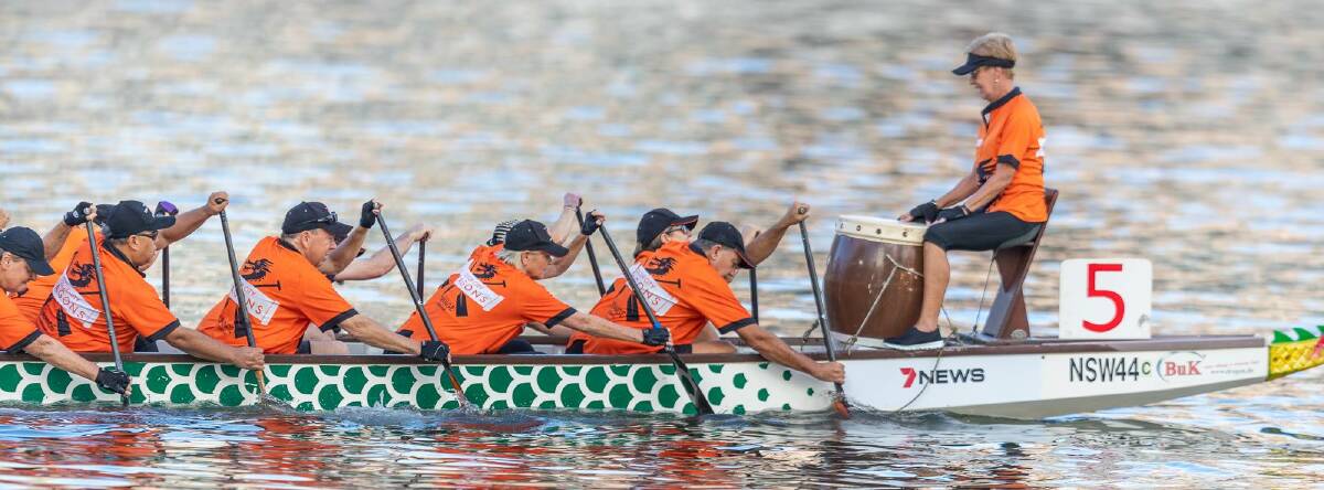 FUN SPORT: Orange's Colour City Dragons team competing in the annual Sydney Lunar Festival Dragonboat Regatta at Darling Harbour.