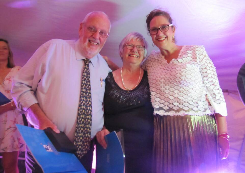 AWARD: Colin Pryor and Jan Kerr from the balloon challenge, accept the Cabonne Daroo Business Awards trophy for Excellence in Tourism from Orange 360's Caddie Marshall. Photo: Supplied