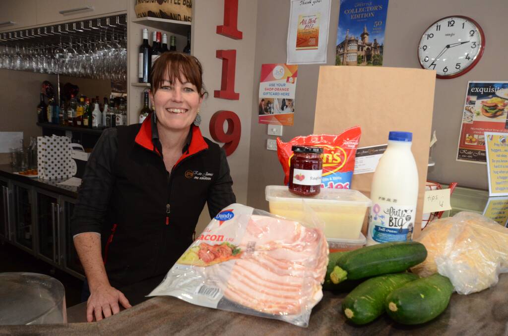 COMPASSION: Kate Jones with some of the ingredients going into the care boxes she is handing out to people in need in Orange. Photo: JUDE KEOGH