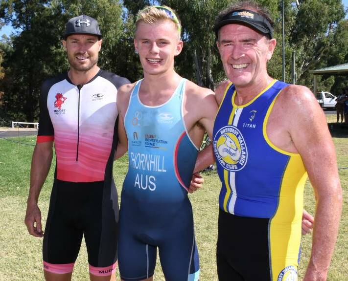 WINNING GRIN: Rory Thornhill (centre) with Gareth Fuller and Mark Windsor after the interclub triathlon in Dubbo. Photo: AMY MCINTYRE