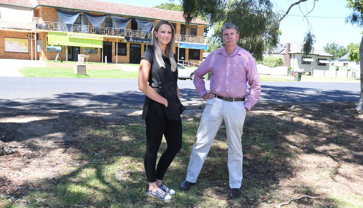CONCERNS: Jody Thornberry and Cr Glenn Taylor at Perry Oval with Clinton Street and the shops in the background. Photo: JUDE KEOGH