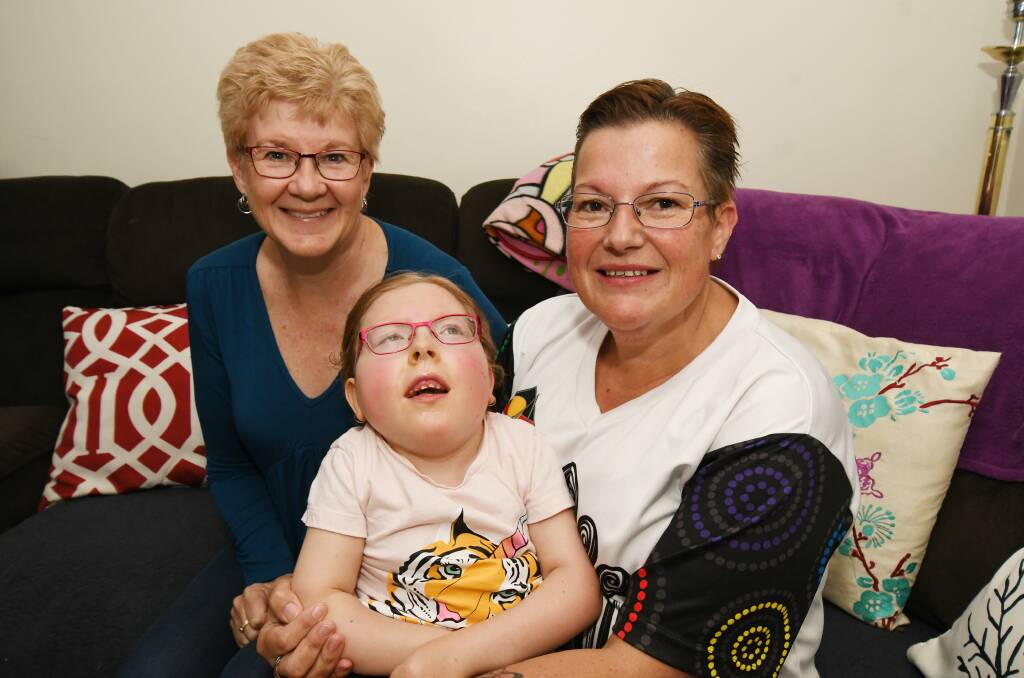 STRONG TEAM: Palliative care volunteer Debi Finlay with Heidi Kendall and her dedicated mum Sonya Holmes. Photo: JUDE KEOGH 0521jkcare2