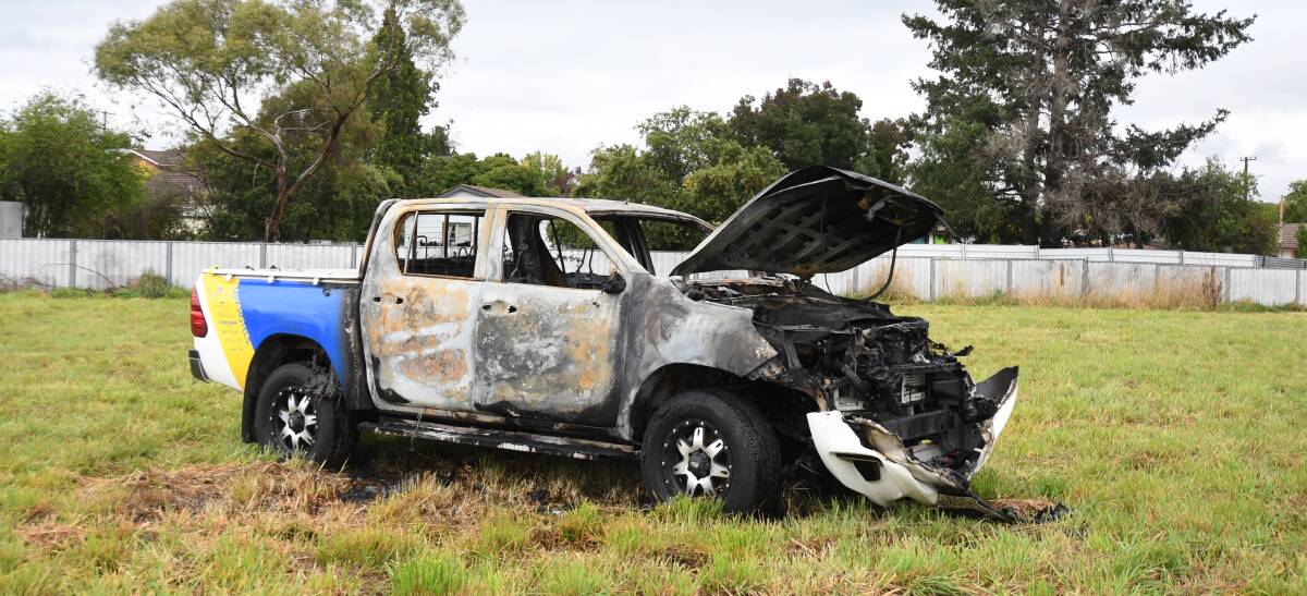 DESTROYED: The stolen 4WD ute which was burnt out on grassland off Torulosa Way. Photo: CARLA FREEDMAN