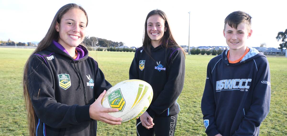 EXCITED: Caitlin and Hailey Prestwidge and Jack Dean will be playing in this weekend's junior touch football state carnival in Orange. Photo: JUDE KEOGH 0709jktouch1
