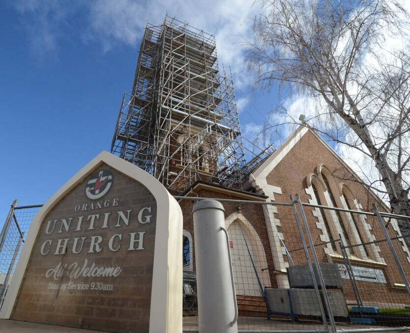 RENOVATING: The Orange Uniting Church spire will be re-clad in copper and lit up at night with funding including $27,000 from council. Photos: JUDE KEOGH